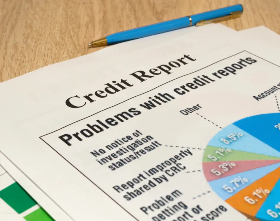 Credit report with errors highlighted for dispute to improve credit score